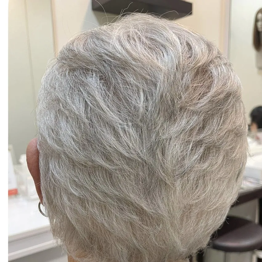 Real HEADS client — full natural grey hair after, back view