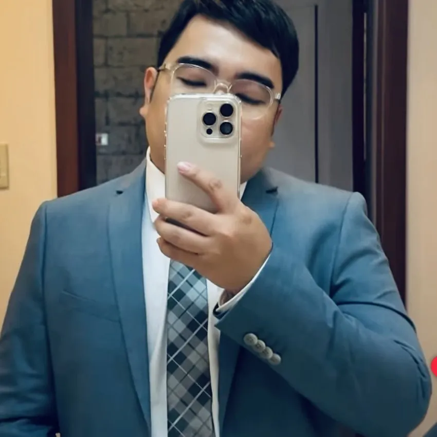 Real HEADS client in business attire with a natural hair system