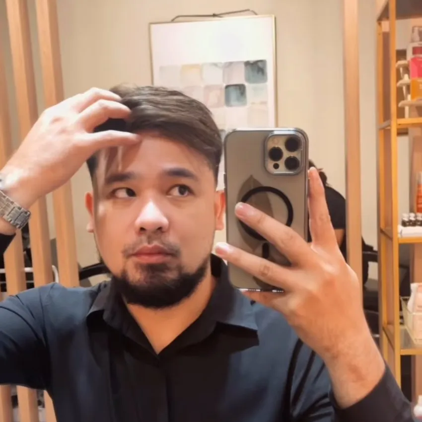 Real HEADS client wearing a custom hair system, styled
